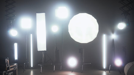 Bright continuous lights setup on professional film set. Backstage