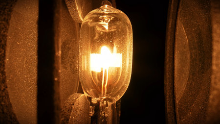 Macro shot of glowing halogen light bulb with textured background