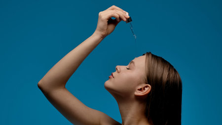 Woman Applying Facial Serum with Dropper for Skincare Routine