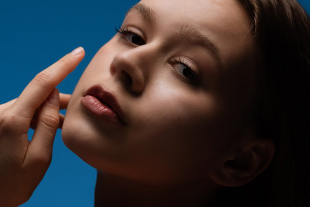 Close-Up Portrait of a Woman with Soft Natural Makeupの写真素材