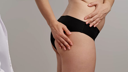 Close Up Image of Person Holding Hip Areaの写真素材