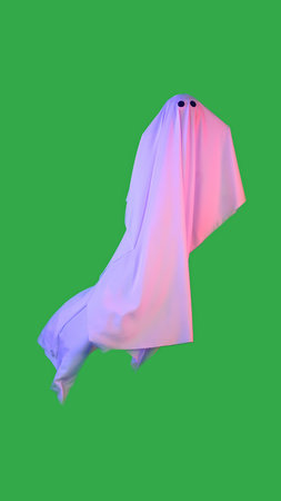 Floating Ghost with Pink and Blue Glow on Green Backgroundの写真素材