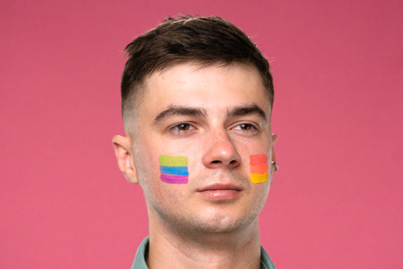 Person Portrait with Painted Face on Pink Backgroundの写真素材