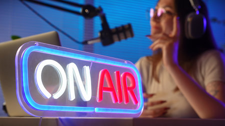 Podcast Studio with Host and On Air Neon Signの写真素材