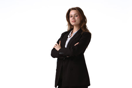 Confident Young Woman in Formal Business Suit Posing Gracefully isolated on white backgroundの写真素材