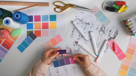Creative Fashion Design Process with Color Samples and Sketchesの写真素材