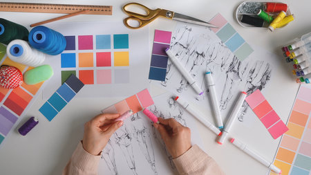 Creative Fashion Design Process with Color Samples and Sketchesの写真素材