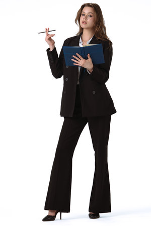 Confident Businesswoman Holding Notebook and Pen in Office Attire isolated on white backgroundの写真素材