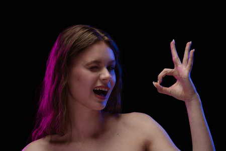 Close Up Portrait of Woman Making Hand Gestureの写真素材