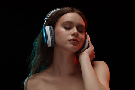 Portrait of Woman Enjoying Music with Headphones Onの写真素材