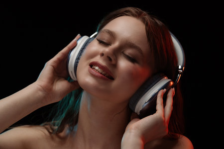 Portrait of Woman Enjoying Music with Headphones Onの写真素材