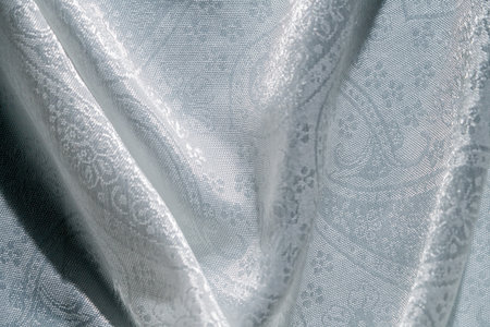 Elegant Silver Fabric with Intricate Patternの写真素材