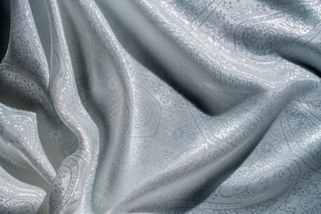 Elegant Silver Fabric with Intricate Patternの写真素材