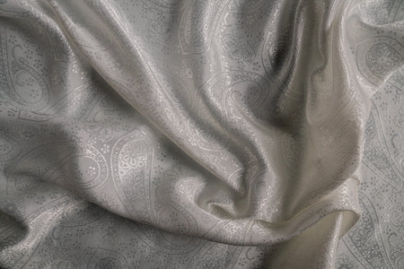 Elegant Draped Fabric with Intricate Paisley Patternの写真素材