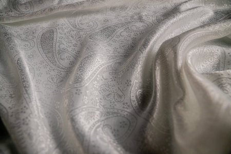 Elegant Draped Fabric with Intricate Paisley Patternの写真素材