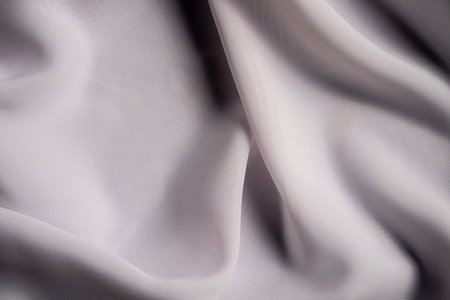 Elegant Draped White Fabric with Smooth Silky Texture