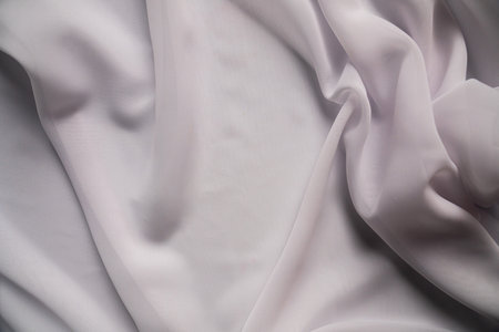 Elegant Draped White Fabric with Smooth Silky Textureの写真素材