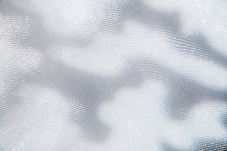 White Textured Fabrics with Subtle Light Sparklesの写真素材