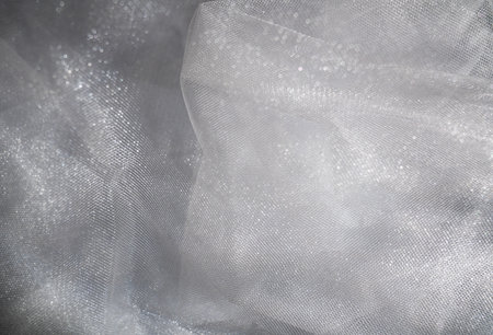 Soft White Fabric with Texture and Foldsの写真素材