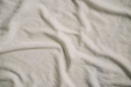 Crinkled White Soft Fabric Surface With Wrinklesの写真素材