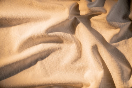 Soft Beige Fabric with Gentle Lightingの写真素材