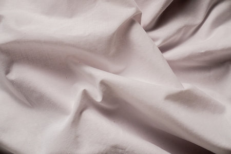 Soft Creased White Fabric with Gentle Textural Detailsの写真素材