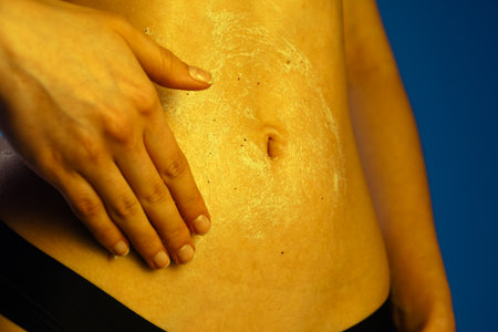 Scrub for manual application on the abdomen to moisturize the skinの写真素材