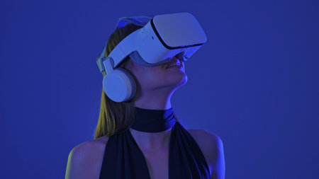 Woman Experiencing Immersive Virtual Reality With Headset