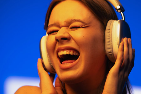 Young Woman Enjoying Music on Headphones with Eyes Closed