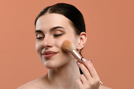 Woman Smiling While Applying Makeup with Brush