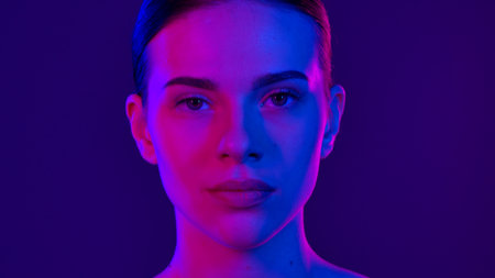 Colorful Neon Portrait With Half Blue Half Pink Lightingの写真素材