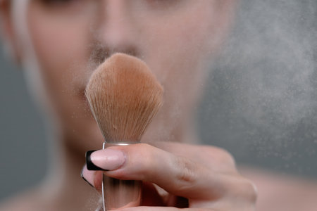 Close up of Face Powder Application with Makeup Brushの写真素材