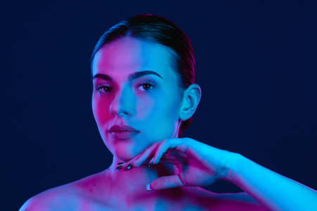 Colorful Portrait of Woman with Dramatic Neon Lightingの写真素材