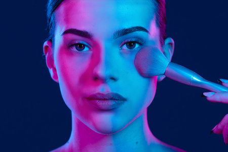 Vibrant Makeup Artistry With Dual-Toned Lighting Effectsの写真素材