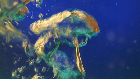 Air bubbles forming abstract shapes underwater on blue background