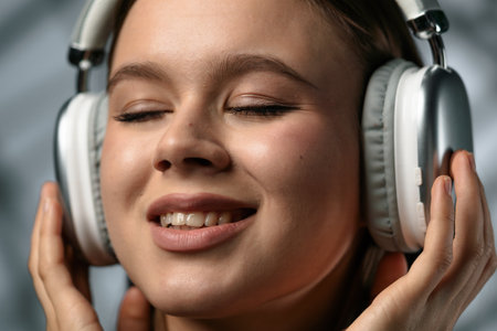 Woman Listening to Music with Headphones Enjoying the Sound