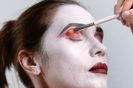 Artistic Makeup Application with Bright Eyeshadow Colors