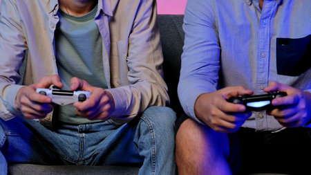 Two People Enthusiastically Playing Video Games Togetherの写真素材
