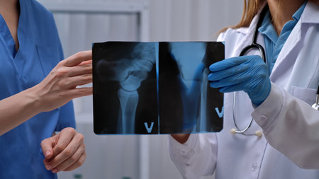 Doctors Analyzing X Ray Images in Medical Examination Room