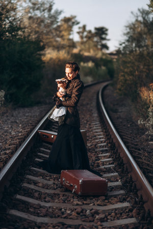 Woman with Vintage Suitcase on Railroad Tracks in Autumn