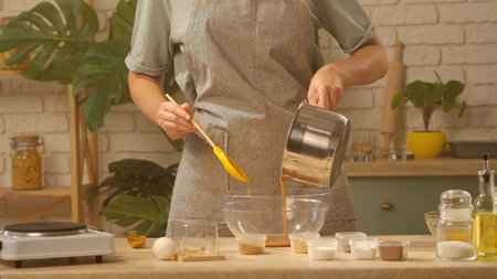 Preparing Ingredients in Modern Kitchen for Delicious Bakingの写真素材