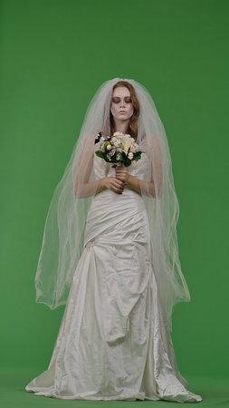 Dead Bride in a Wedding Dress on a Green Background