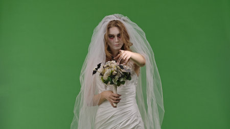 Dead Bride in a Wedding Dress on a Green Background