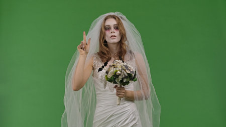 Dead Bride in a Wedding Dress on a Green Background