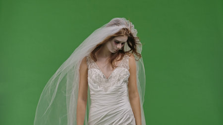 Dead Bride in a Wedding Dress on a Green Background