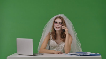 Bride Working on Laptop at Desk