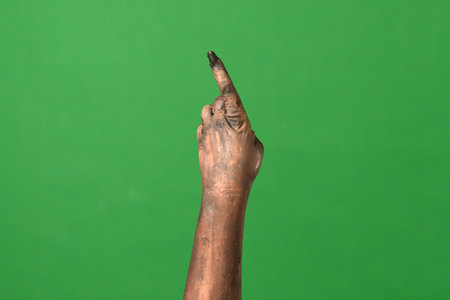 A creepy zombie hand points upwardの写真素材