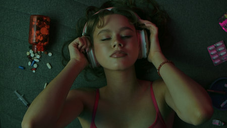 Woman with drugs, cigarettes and pills