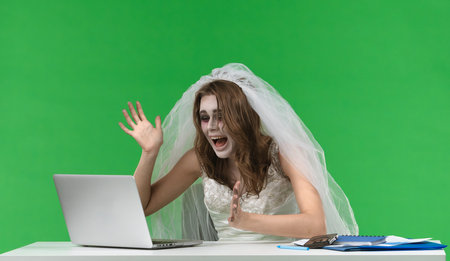 Dead Bride Working on Laptop at Desk