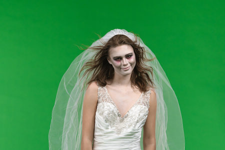 Dead Bride in a Wedding Dress on a Green Background